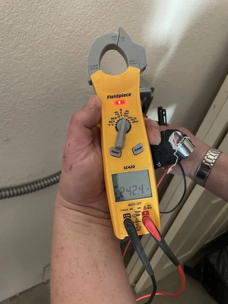 Voltage testing with clamp meter during Outlet Installation in Potsdam